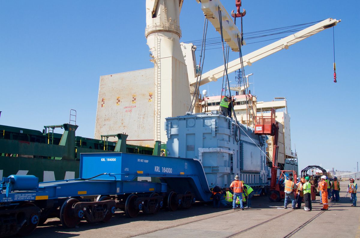 Heavy cargo transferred from rail to vessel